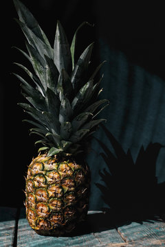 Raw pineapple in a dark background