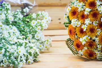 Flower bouquet on wooden table background,soft focus.