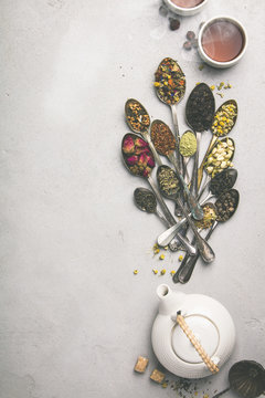 Assortment of dry tea in vintage spoons
