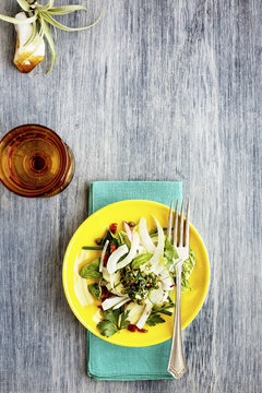 Fennel Herb Salad with Italian Style Salsa Verde. Photographed on a b;ack/grey background.