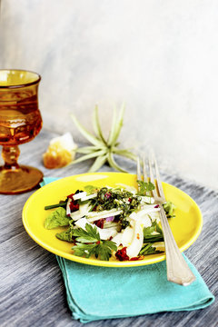 Fennel Herb Salad with Italian Style Salsa Verde. Photographed on a b;ack/grey background.
