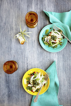 Fennel Herb Salad with Italian Style Salsa Verde. Photographed on a b;ack/grey background.