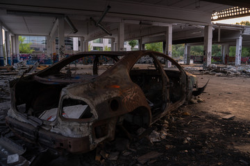 Wasted cars in abandoned car dealership