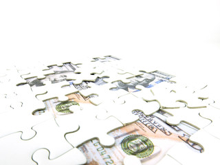 Missing jigsaw puzzle pieces on 100 Dollar money background, Key for Business solution success...