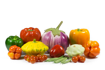 The harvest of natural vegetables produced in rural areas: sweet peppers of different colors, patissons, eggplants, small tomatoes, asparagus. 