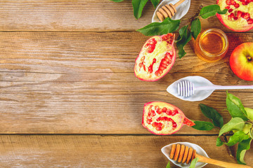 Rosh hashanah jewish New Year holiday concept. Traditional symbol. Apples, honey, pomegranate. Copy space. Top view. Flat lay.