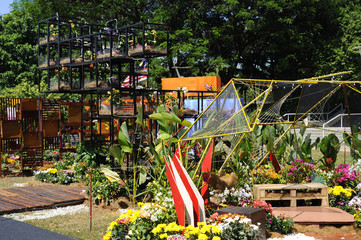 Small pocket garden made from mix of recycle material and flowers at Floria Garden, Putrajaya, Malaysia. 