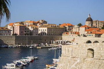 Fototapeta na wymiar Croatia. Dubrovnik - July 22, 2018. Overview to the old town and the berth with the ships