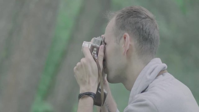 Photographer takes pictures with camera.