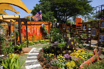 Small pocket garden made from mix of recycle material and flowers at Floria Garden, Putrajaya, Malaysia. 