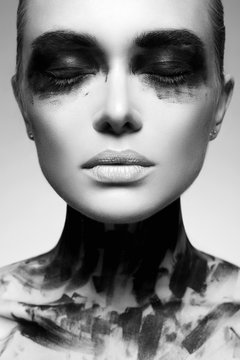 Black and white portrait of Girl in Black Paint