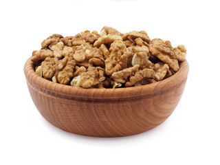 Good for your health. Fruits of a walnut in a plate on a white background. 