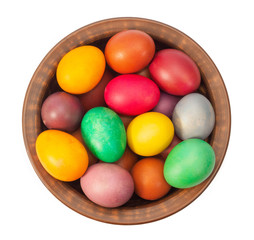 Fototapeta na wymiar Traditional Easter eggs in a wooden plate on a white background