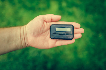 pagers. old vintage beeper. pager in hand