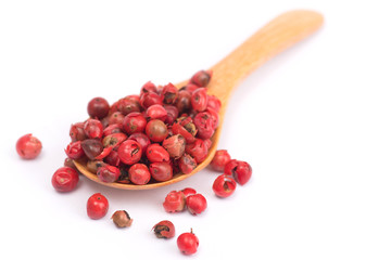 pink peppercorns isolated on white background, dried berries of Peruvian pepper tree