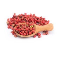 pink peppercorns isolated on white background, dried berries of Peruvian pepper tree