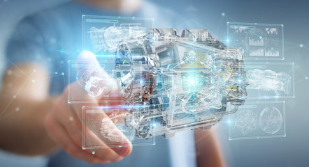 Businessman using wireframe holographic 3D digital projection of an engine