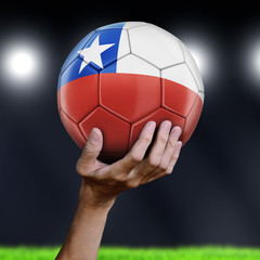 Man holding Soccer ball with Chilean flag