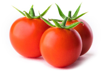 Three small red tomatoes