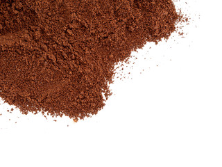 Ground roasted coffee, spilled and isolated on white