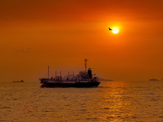 The tanker vessel(LPG) sailing for delivery LPG to industrial port of Thailand on silhouette