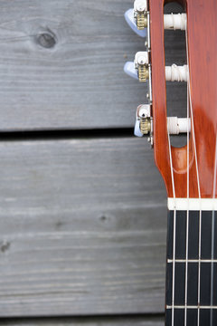 acoustic guitar neck on wooden ground