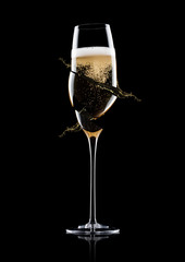 Elegant broken glass of yellow champagne with bubbles
