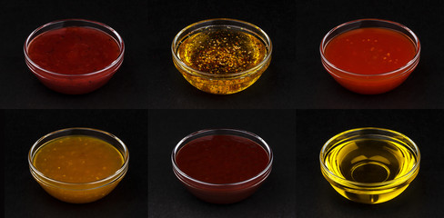 Different sauces isolated on black background