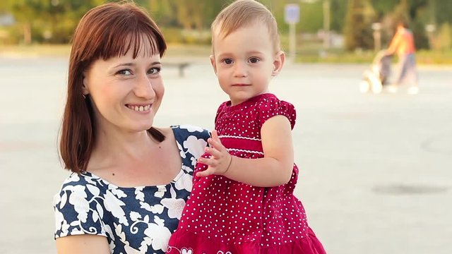 Amazed baby looking at camera and gesticulating with hand