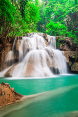 Fototapeta na wymiar Beautiful waterfall in the deep forest in Thailand