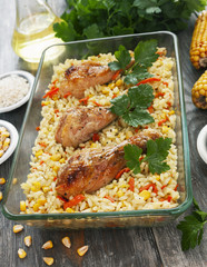 Chicken legs baked with rice and vegetables