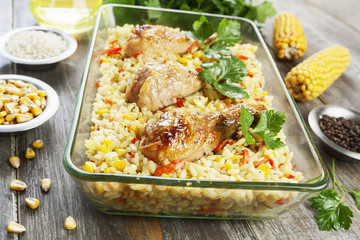 Chicken legs baked with rice and vegetables