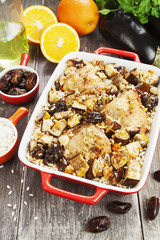 Chicken thigh baked with rice, eggplant and figs