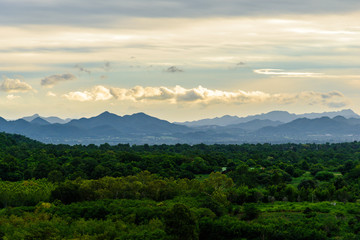 Landscape of cloudy, mountain and forest with sunset in the evening from top view.