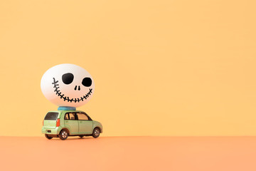 Spooky egg on car.Halloween design with copy space for Halloween concept background.