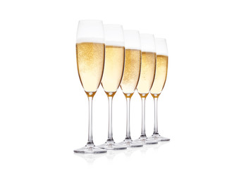 Elegant glasses of yellow champagne with bubbles