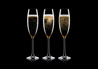 Elegant glasses of yellow champagne with bubbles
