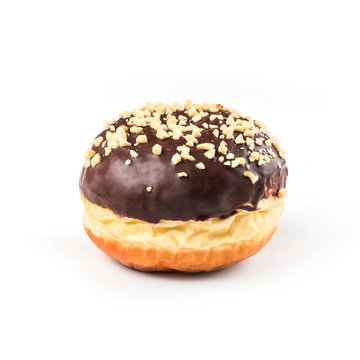 Chocolate glazed donut, top view over white background, isolated. With nuts