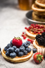 Pancakes with fruits, close up view