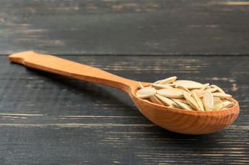 Pumpkin seeds in a spoon