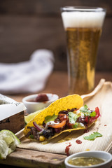 Tacos served with beer glass