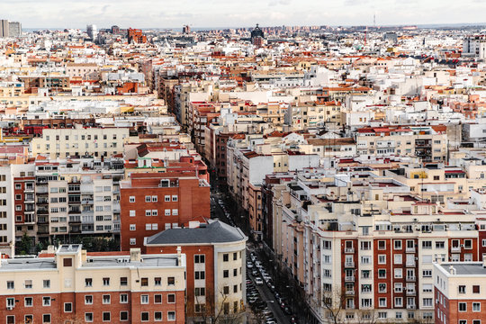 Color residential quarter in Madrid with a street in middle