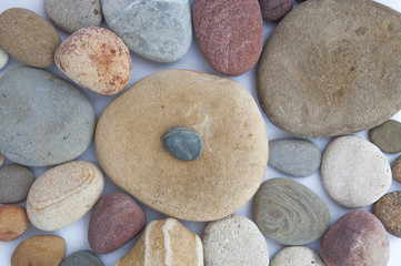 colorful sea stones on white background