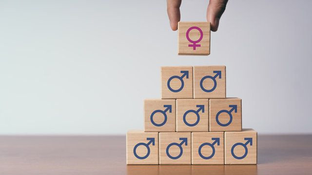 Concept of wooden male and female sex symbols