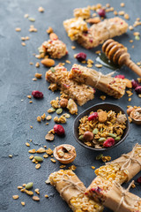 Obraz na płótnie Canvas Healthy homemade cereal muesli granola bars for breakfast