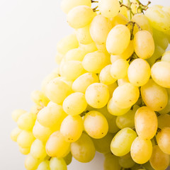 Organic green grapes on a light background. square