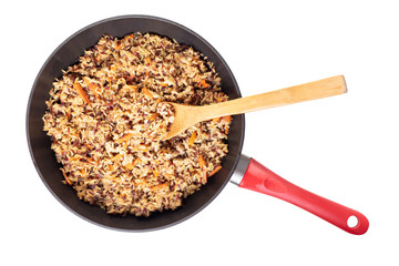 assorted cooked rice with vegetables in a frying pan