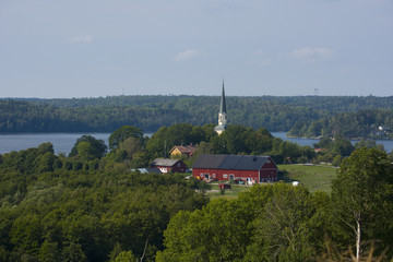 Fototapeta premium Ekerö church partly from 1200s located at the lake Mälaren in Stockholm