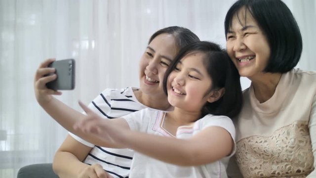 Slow motion 4K Happy Asian family take selfie photo together, Happiness moment