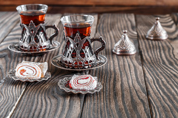 Fragrant Turkish tea and Turkish sweets in national dishes